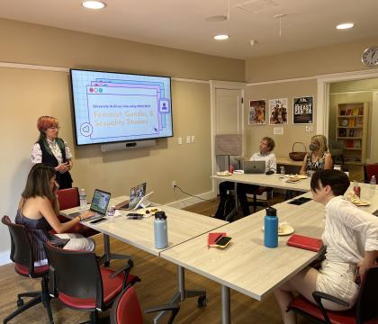 A student giving presentation on feminist, gender, and sexuality studies 