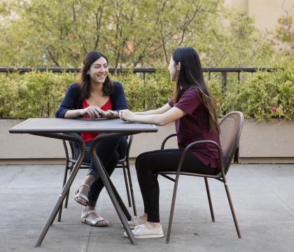two students sitting at a table