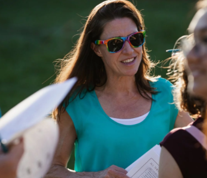 A person with sunglasses looking towards the camera