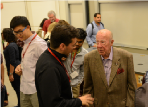 Sec. Shultz speaking with a student.