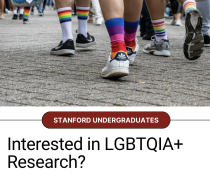Picture of people walking in Rainbow socks, text says "Interested in LGBTQIA+ Research?"