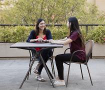two students sitting at a table